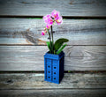 Blue police-box-shaped orchid pot with diamond ventilation holes — image 1 of 5