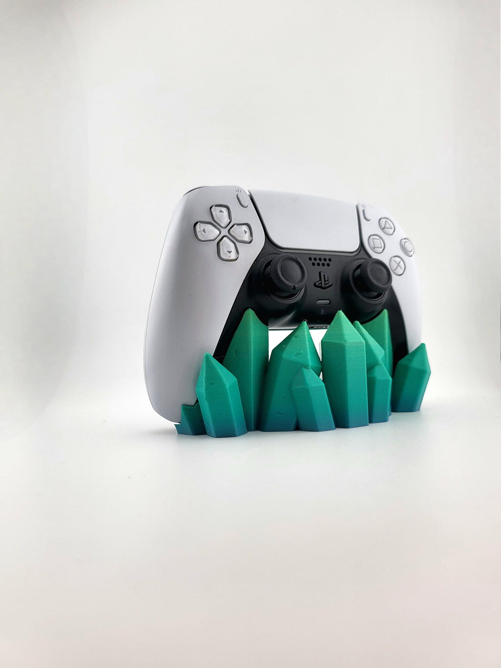 Front view of teal-green crystal controller stand; pictured color example, controller excluded