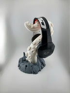 Light tentacle headphone stand with dark gray rocky base holding headphones; headphones excluded