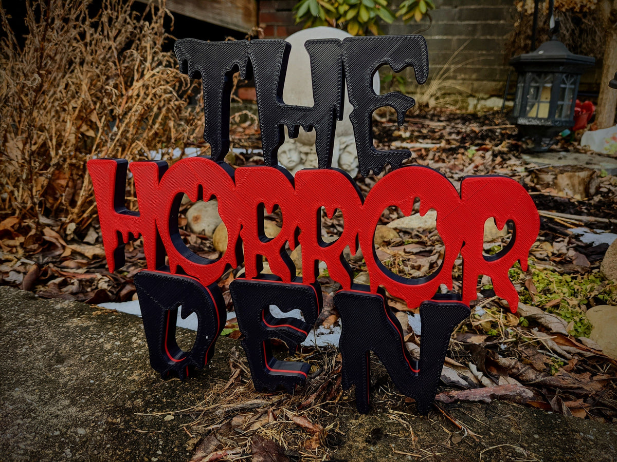 Layered red and black Horror Den 3D-printed sign — image 2 of 5