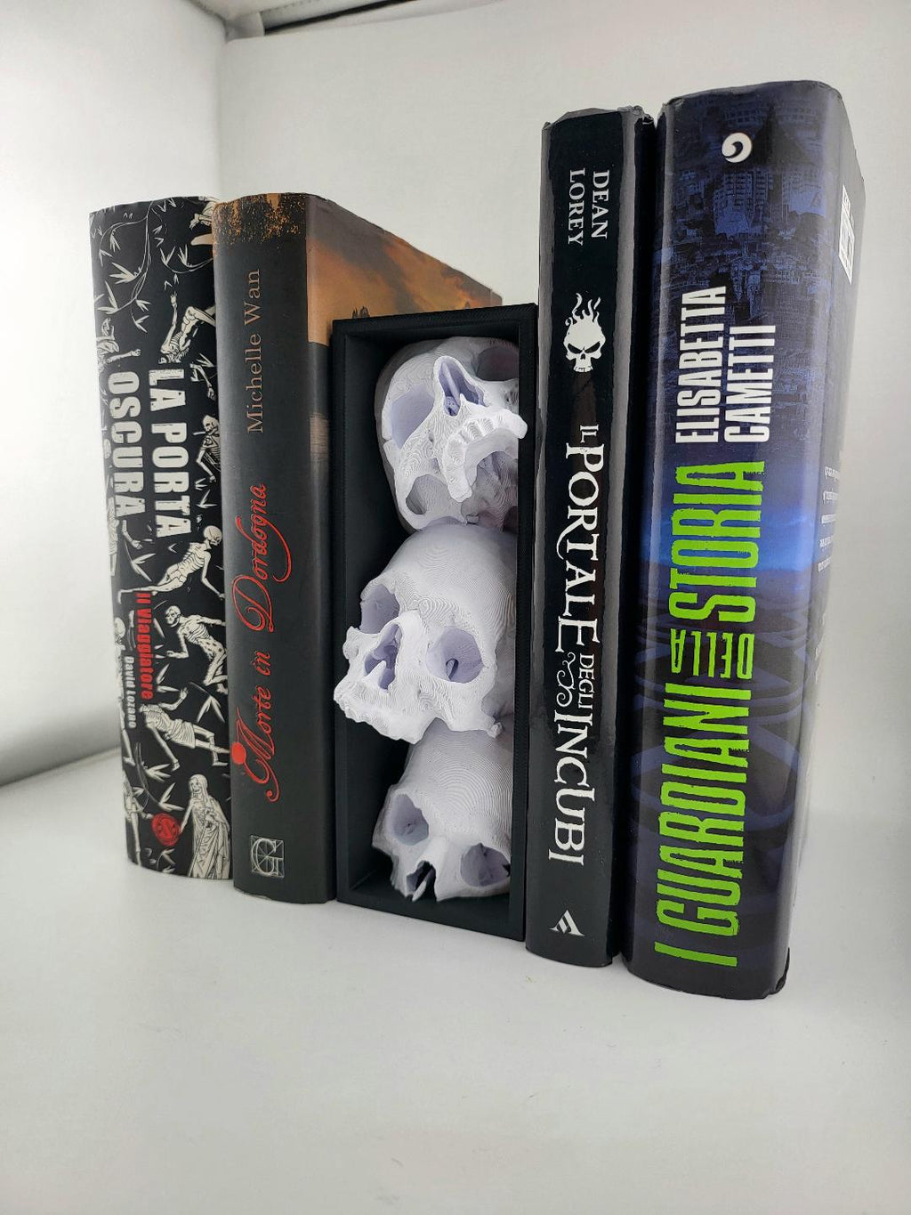 Side angle of the skull book nook on a bookshelf