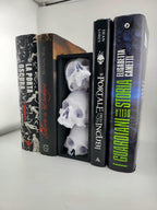Side angle of the skull book nook on a bookshelf