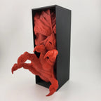 Angled view of the red demon hand book nook and black display box