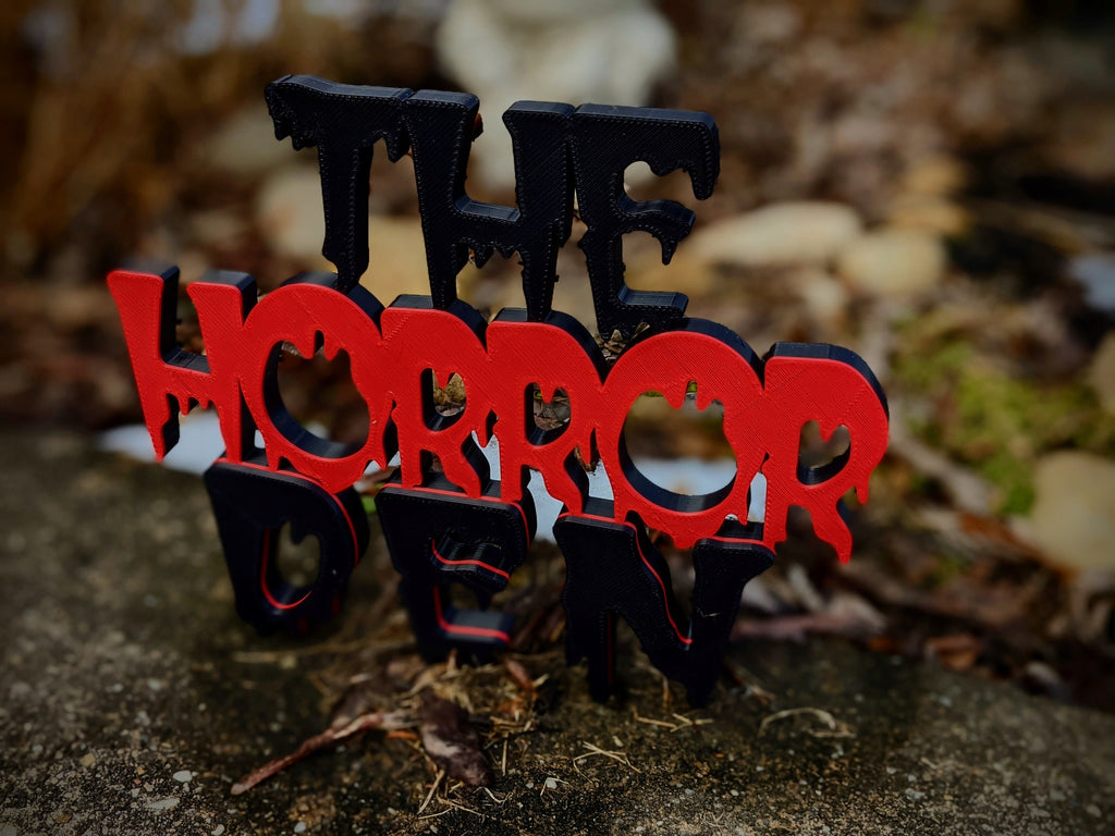 Layered red and black Horror Den 3D-printed sign — image 4 of 5