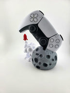 Gray moon base, white smoke and red rocket with controller; controller excluded