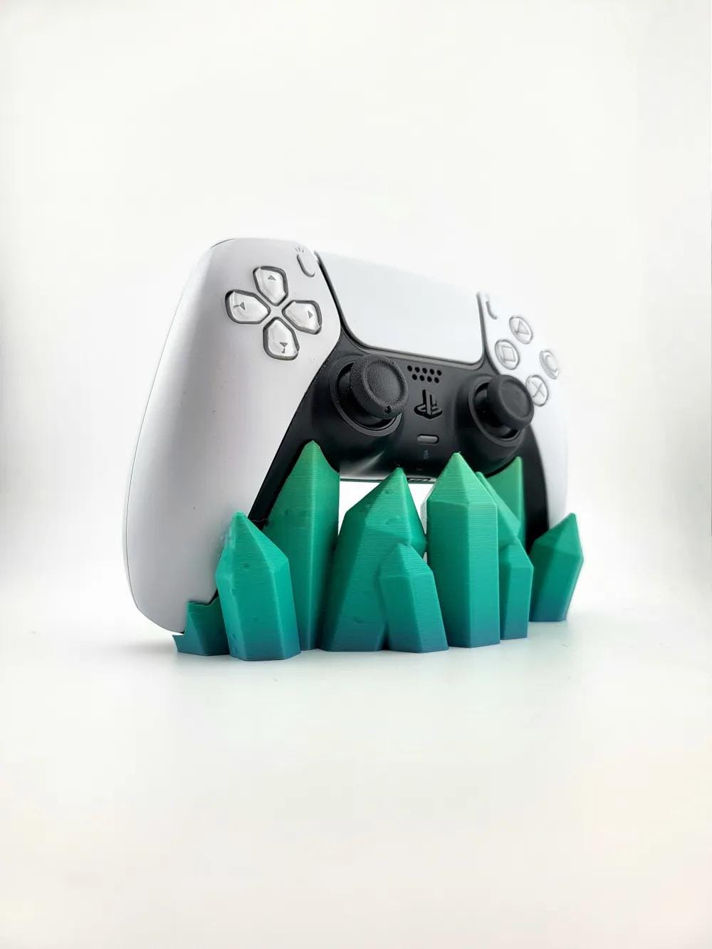 Angled front view of teal-green crystal stand; pictured color example, controller excluded