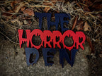 Layered red and black Horror Den 3D-printed sign — image 3 of 5