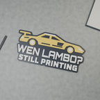 Computer-generated hero render of the WEN LAMBO? STILL PRINTING sign with a yellow sports car and white text on charcoal.