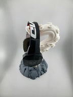Side view of the tentacle stand holding headphones; headphones excluded