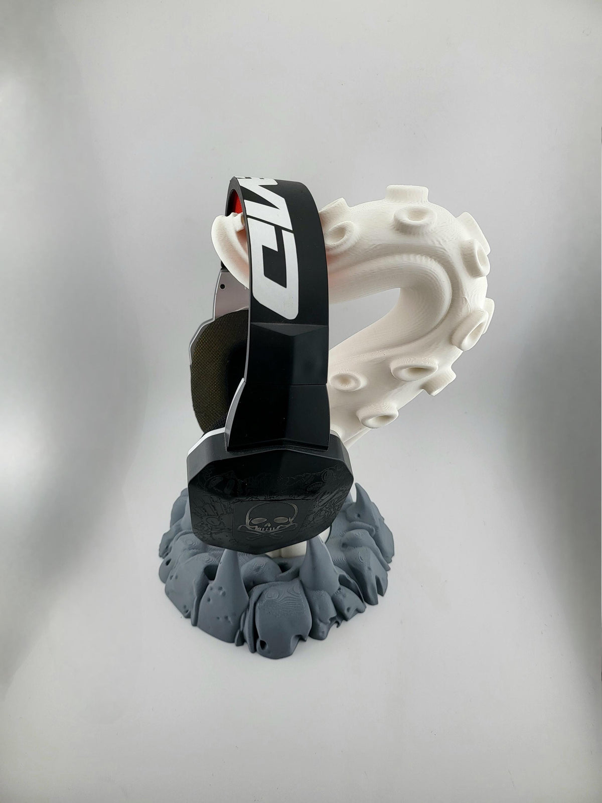 Side view of the tentacle stand holding headphones; headphones excluded